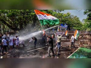 Kochi: Police use water cannons to disperse Congress workers during a protest ma...