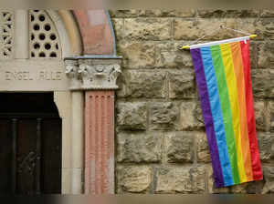 FILE PHOTO: A rainbow flag is seen on the wall of a Catholic church in Cologne