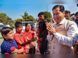 Guwahati: Union Minister Sarbananda Sonowal interacts with children during All A...