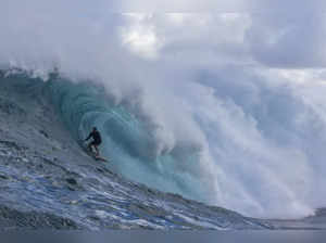 US surfer Albee Layer rides a wave as a big swell hits Pe'ahi surfing break, known as Jaws, on the north shore of the island of Maui, Hawaii on October 18, 2023.