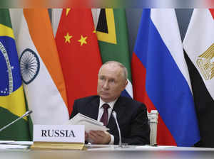 Russian President Vladimir Putin takes part in an extraordinary BRICS summit to ...