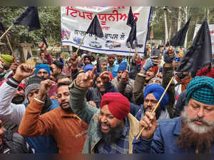Patiala: Members of various truck operators unions participate in a protest rall...