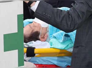 South Korea's opposition Democratic Party leader Lee Jae-myung arrives at Seoul National University Hospital after being stabbed in the neck during his visit to Busan, in Seoul