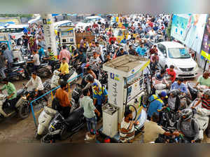 Hyderabad: People queue up at a petrol pump amid the ongoing truck drivers' prot...