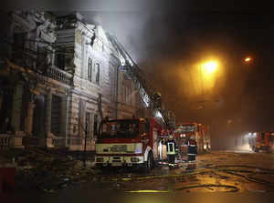 In this photo provided by the Ukrainian Emergency Service, firefighters put out ...