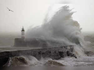 Waves crash over Newhaven Lighthouse and the breakwater in Newhaven on January 2, 2024, as Storm Henk brought strong winds and heavy rain across much of southern England.