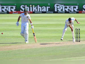 India's Mohammed Siraj (R) delivers a ball as South Africa's Aiden Markram (L) looks on during the first day of the second cricket Test match between South Africa and India at Newlands stadium in Cape Town on January 3, 2024.