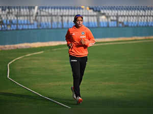 India's captain Harmanpreet Kaur warms up before the start of the final day play of the women's Test cricket match between India and Australia at the Wankhede Stadium in Mumbai on December 24, 2023.