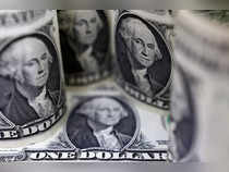 Dollar set for strongest week since July on reduced rate cut bets