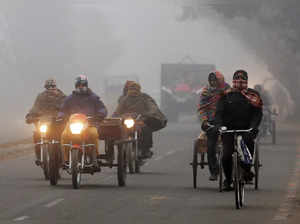 Amritsar, Jan 04 (ANI): Commuters travel amid a cold and foggy weather in Amrits...