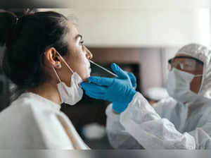 Spain considers nationwide hospital mask rule, as flu, COVID hit Europe
