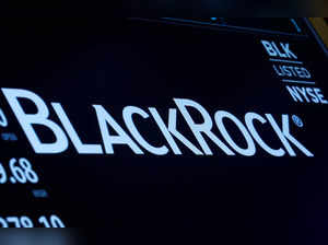 FILE PHOTO: The company logo and trading information for BlackRock is displayed on a screen on the floor of the NYSE