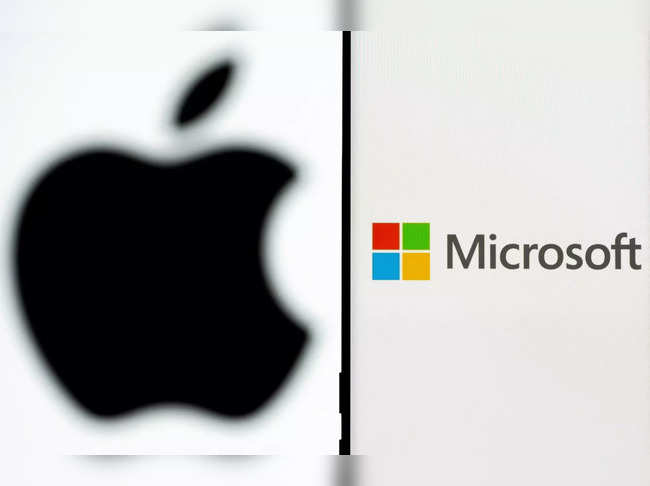 FILE PHOTO: Microsoft logo is seen on the smartphone in front of displayed Apple logo in this illustration taken