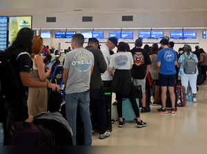 Passengers try to rebook their tickets from cancelled United Airlines flights in San Juan