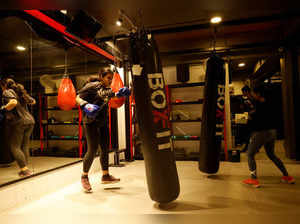 Women train in kickboxing at BoxFit, a fitness studio, in New Delhi