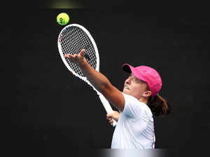 Poland’s Iga Swiatek serves during a training session in Melbourne on January 13, 2024 ahead of the Australian Open tennis championship starting on January 14.