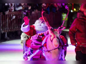 Man dressed as Santa Claus leaves for his Christmas journey from the Santa's Village in Finnish Lapland in Rovaniemi