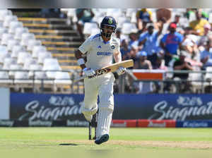 India's KL Rahul runs between the wickets during the first day of the second cricket Test match between South Africa and India at Newlands stadium in Cape Town on January 3, 2024.