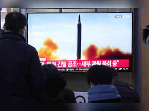 A TV screen shows a file image of North Korea's missile launch during a news pro...