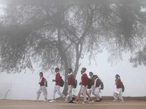Gurugram: Students amid fog on a cold winter morning, in Gurugram. (PTI Photo) (...