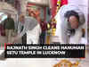 Def Minister Rajnath Singh participates in cleanliness drive at a temple in Lucknow ahead of Pran Pratishtha event