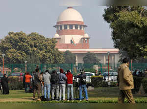 Television journalists are seen outside the premises of the Supreme Court in New Delhi
