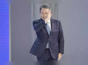 Premier of China Li Qiang greets attendees as he arrives to the opening of the A...
