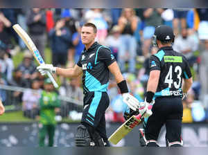 New Zealand's Finn Allen (L) celebrates after scoring his century (100 runs) during the third Twenty20 international cricket match between New Zealand and Pakistan University Oval in Dunedin on January 17, 2024.