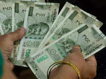 Rupee ends lower pressured by likely equity outflows, stronger dollar