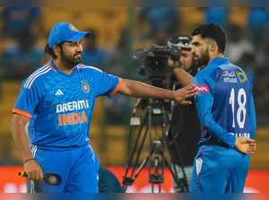 Bengaluru: India's captain Rohit Sharma with Afghanistan's Ibrahim Zadran after ...
