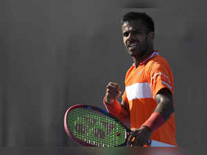 Sumit Nagal of India reacts after winning a point against Shang Juncheng of Chin...