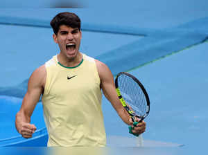 Spain's Carlos Alcaraz celebrates after victory against Italy's Lorenzo Sonego during their men's singles match on day five of the Australian Open tennis tournament in Melbourne on January 18, 2024.