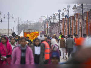 Ayodhya: People at Ram Path ahead of the consecration ceremony of Ram Temple, in...