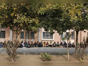 Skilled workers wait for their interview and skill test at a Haryana state government recruitment drive to send workers to Israel, at Maharshi Dayanand University in Rohtak