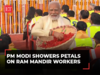 PM Modi showers petals on Ram Mandir construction workers after Ram Lalla consecration