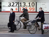 Japan shares hit 34-yr highs, yen steady ahead of BOJ decision