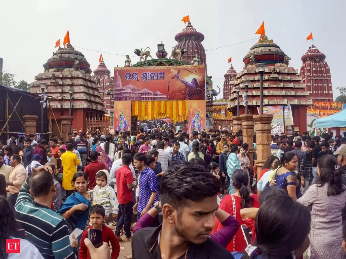 Devotees swarm the main gate of the Ram Temple in Ayodhya, causing a ...