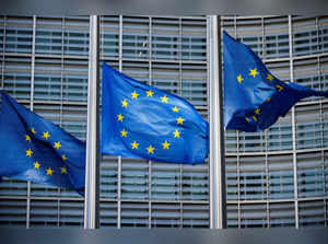 FILE PHOTO: European Union flags fly outside the European Commission headquarters in Brussels