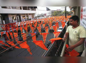 Bhopal: A worker decorates a market with saffron flags, ahead of Shri Ram Janmab...