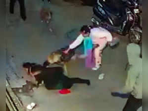 **EDS: GRAB FROM A CCTV** New Delhi: A dog attacks a two-year-old boy in Vishwas...