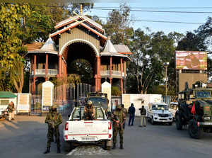 Paramilitary troopers stand guard outside the Kangla Fort in Imphal