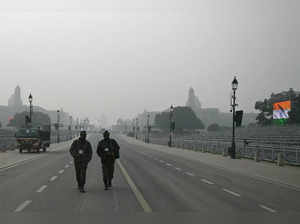 Security personnel walk along the Kartavya Path ahead of India's upcoming Republic Day parade in New Delhi on January 23, 2024.