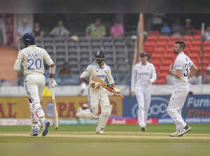 Hyderabad: India's Ravindra Jadeja and Axar Patel run between the wickets during...