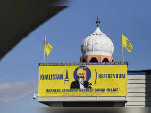FILE PHOTO: A banner with the image of Sikh leader Hardeep Singh Nijjar is seen at the Guru Nanak Sikh Gurdwara temple, site of his June 2023 killing, in Surrey