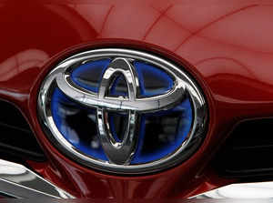 FILE PHOTO: The Toyota logo is pictured on a Toyota car in Tokyo