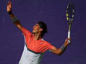 Rafael Nadal of Spain serves to Novak Djokovic of Serbia during the Final of the Sony Open at Crandon Park Tennis Center on March 30, 2014 in Key Biscayne, Florida.