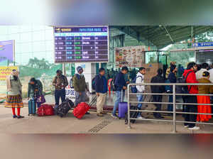 Ranchi: Passengers wait in queue at the Birsa Munda Airport on a cold winter mor...