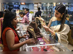 Mumbai: A woman purchases gold ornaments on the occasion of Akshaya Tritiya, at ...