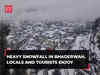 J&K: Heavy snowfall in Bhaderwah, locals and tourists enjoy, watch!