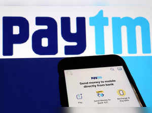 FILE PHOTO: The interface of Indian payments app Paytm is seen in front of its logo displayed in this illustration picture
